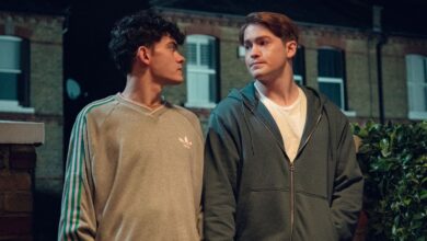 Nick and Charlie walk down the street in Heartstopper