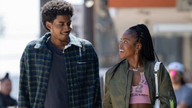 A guy and a girl talk to each other at school