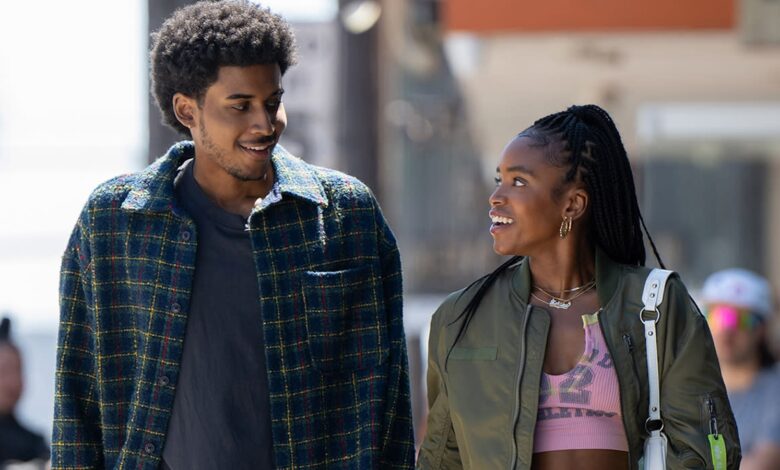 A guy and a girl talk to each other at school